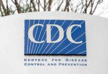 CDC’s Lice Guidelines Cause Parental Uproar Sign displaying the CDC logo and full name, Centers for Disease Control and Prevention
