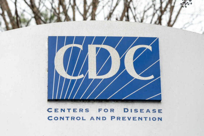 Sign displaying the CDC logo and full name, Centers for Disease Control and Prevention
