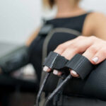Hidden Hormone Sabotaging Blood Pressure Close-up of a patients hand during a medical examination with monitoring equipment