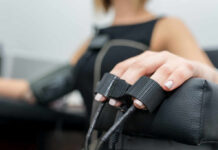 Hidden Hormone Sabotaging Blood Pressure Close-up of a patients hand during a medical examination with monitoring equipment