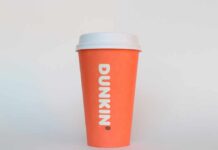 Orange coffee cup with Dunkin' logo