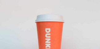 Orange coffee cup with Dunkin' logo