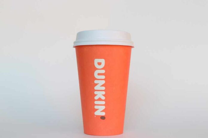 Orange coffee cup with Dunkin' logo