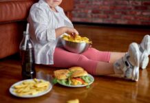 Fried Food Alert: The Hidden DNA Threat Child sitting on the floor enjoying snacks from a bowl