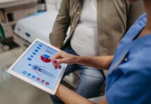 Walking Hack That Defies 10,000-Step Myth Nurse showing a patient health data on a tablet