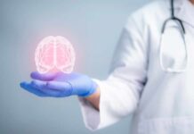 Brain Rewiring Habits That Transform Lives A medical professional holding a glowing digital brain illustration in their hand