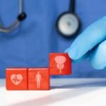 Menopause’s Silent Cardiovascular Risk A doctor's gloved hand placing red blocks with health symbols on a table