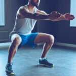 Exercise vs. Inflammation: The 2024 Breakthrough Man performing a squat exercise in a gym