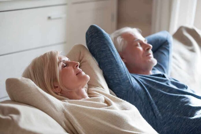 shutterstock_1185179137 Two adults relaxing on a couch with eyes closed