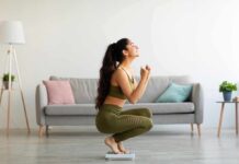 The GLP-1 Weight Rebound Trap Woman in activewear kneeling on a bathroom scale