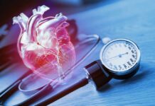 An anatomical heart illustration next to a blood pressure monitor