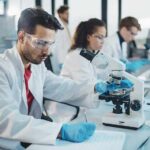 Scientist using a microscope in a modern laboratory