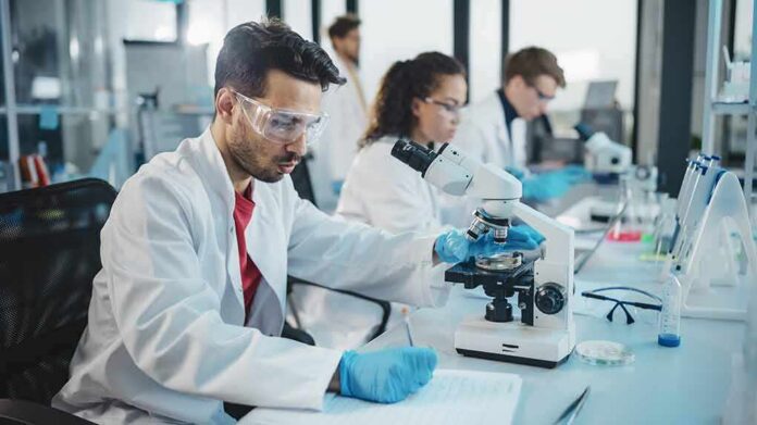 Scientist using a microscope in a modern laboratory