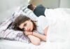 How to Stop a Marriage Drift Woman lying awake in bed next to partner turned away