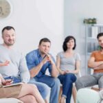 Support group meeting with six adults seated in a circle