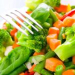 Hidden compound in healthy foods may worsen IBD mixed vegetables with broccoli and carrots on a plate