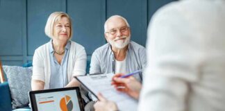 senior couple meeting with advisor at home