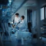 Scientists working in a dim laboratory