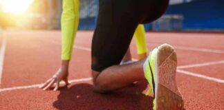sprinter at starting blocks on track