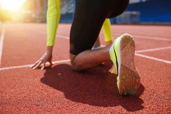 sprinter at starting blocks on track