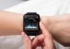 smartwatch displaying heart rate on a person's wrist