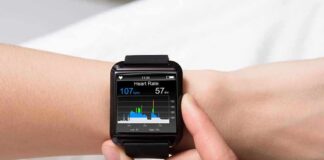 smartwatch displaying heart rate on a person's wrist