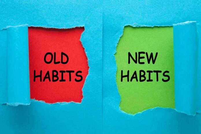 Torn blue paper revealing old habits and new habits text