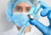 Drill-Free Cavity Killer Stuns Dentists Healthcare worker drawing blue liquid from vial with syringe