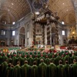 Jonathan Cyprien among clergy during a mass in a grand cathedral interior