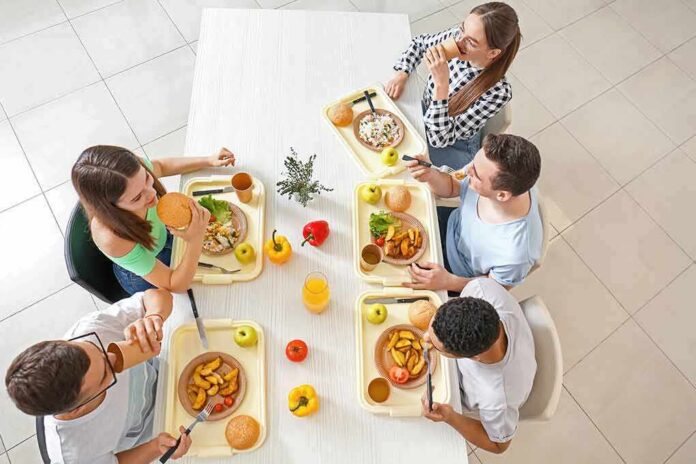Group of friends eating lunch at a cafeteria table